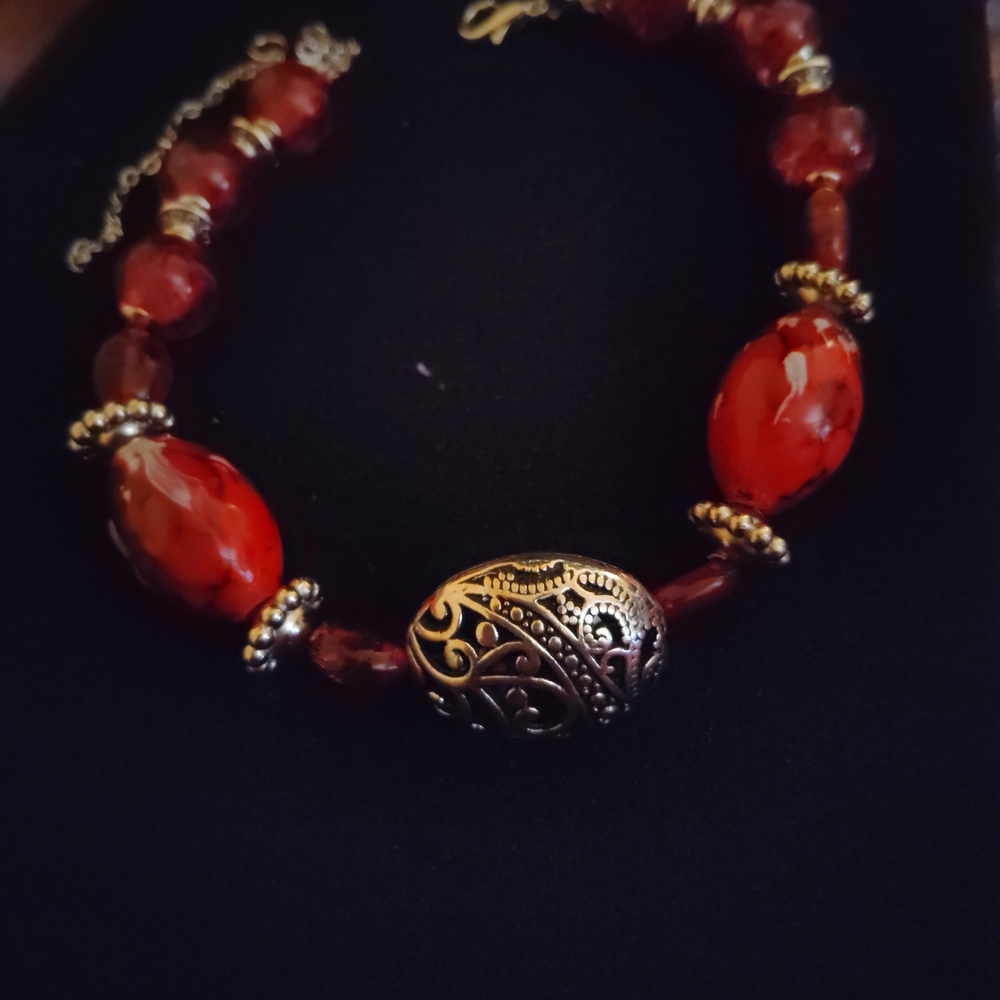 Elegant Red Beaded Bracelet with Intricate Silver Accents